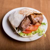 Shish Kebab Sandwich · Includes lettuce, tomato, onions and sauce.