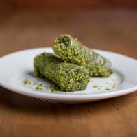 Pistachio Roll · Sweet rolled pastry filled with pistachios and honey syrup.