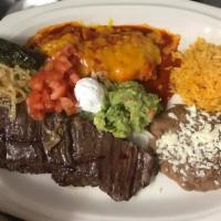 Carne Asada a la Tampiquena · Our famous skirt steak served with cheese and onion enchilada. Served with rice and beans, d...