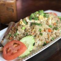Fried Rice · Stir-fried rice with carrots, broccoli, cabbage, white onions, green onions, tomatoes and eg...