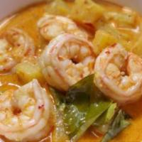 Pineapple  Curry · Creamy panang curry with coconut milk, lime leaves, bell peppers, sweet basil, and pineapple.