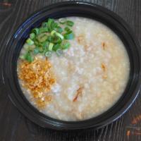 Congee (Arroz Caldo) · Rice porridge with chicken, onions, garlic and ginger.
