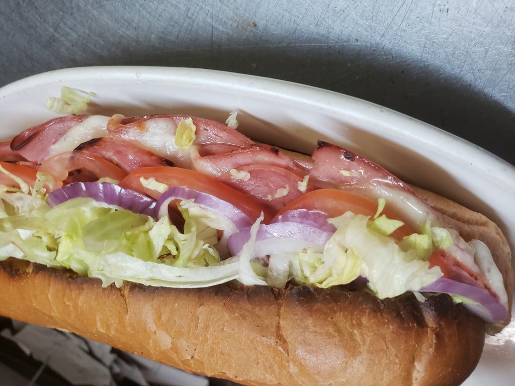 Torpedo   Italian' sub · mayo, Mustard, lettuce, tomatoes, onions, provolone cheese, oil and vinegar, and imported mortadell and Italian salami.