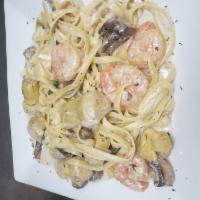Fettuccine Shrimp alfredo · Sauteed in olive oil, fresh garlic, artichoke hearts and mushrooms in Alfredo sauce. include...