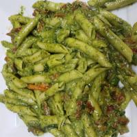 Penne Pesto Sauce · With olive oil, fresh garlic, fresh basil and sun dried tomatoes. Includes garlic bread and ...