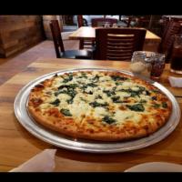 Pizza Florence Pizza · Mozzarella cheese, olive oil, fresh spinach, garlic, ricotta and feta. No sauce