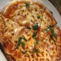 Margherita Pizza · Fresh tomato sauce, mozzarella cheese and basil. Individual size.