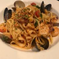 Linguine ai Sette Mari · Fresh squid, shrimp, mussels, clams, scallops and diced fish, sauteed with garlic and a touc...