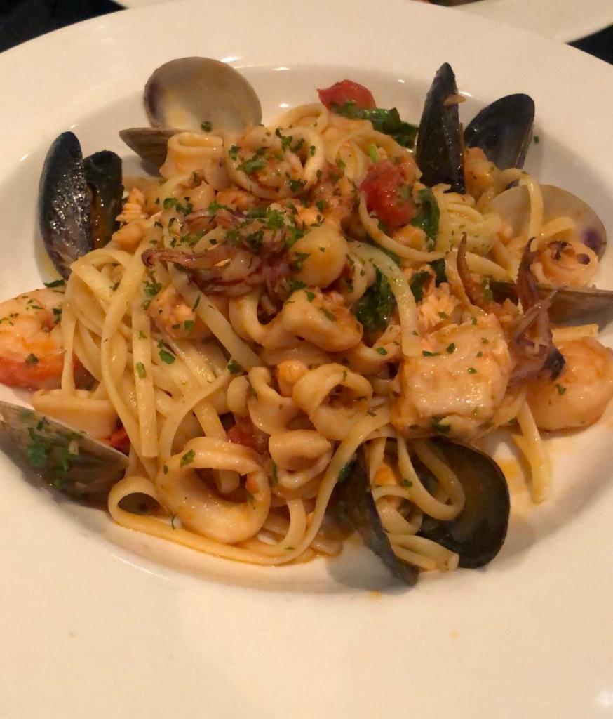 Linguine ai Sette Mari · Fresh squid, shrimp, mussels, clams, scallops and diced fish, sauteed with garlic and a touch of white wine and basil in a fresh tomato sauce.