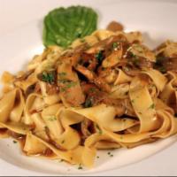 Pappardelle ai Funghi di Bosco · Homemade wide egg noodle pasta served with Porcini and mixed mushrooms in a reduction of Bra...