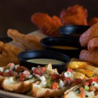 Sombrero Sampler · Spicy level 2. Two buffalo wings, three boneless wings, three chicken tenders, French fries,...