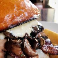 Mushroom Swiss Burger · Topped with sautéed mushrooms, grilled onions, Swiss cheese and garlic spread.