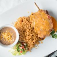 Chili Relleños · A roasted poblano pepper stuffed with mozzarella cheese, wrapped in an egg roll skin, fried ...