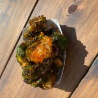 Crispy Brussels Sprouts · Tossed in honey Sriracha sauce.