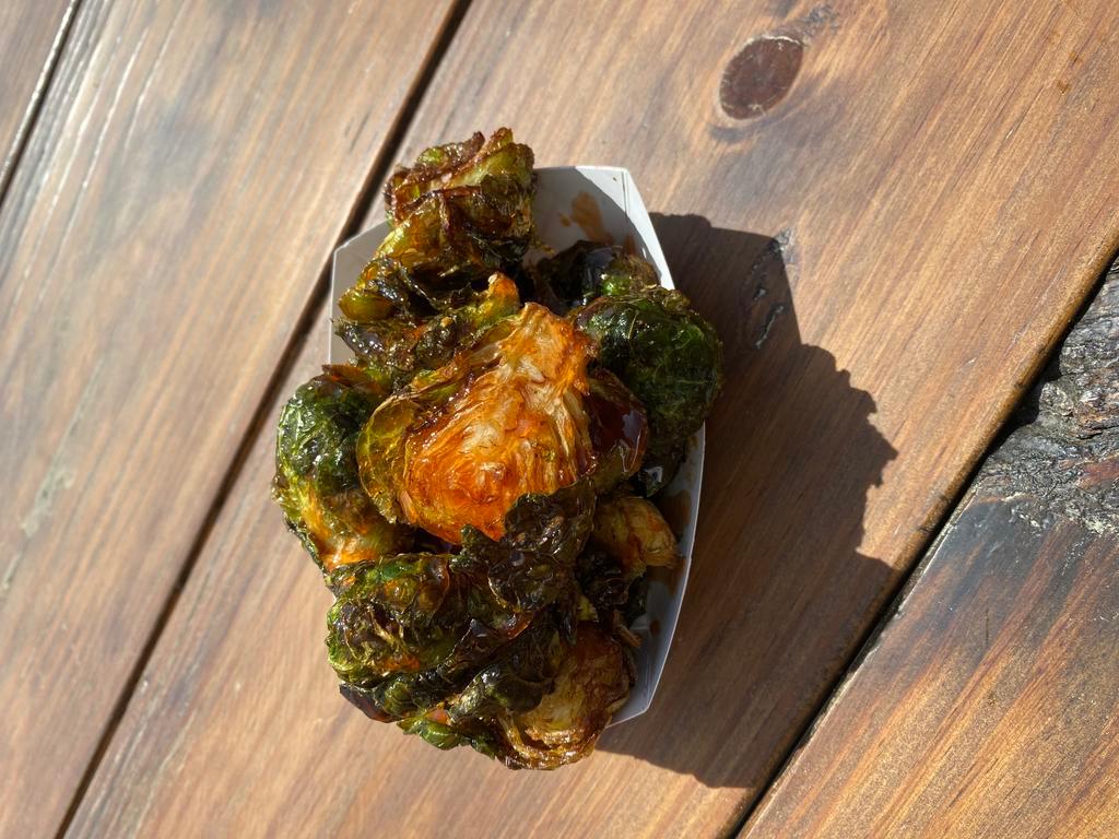 Crispy Brussels Sprouts · Tossed in honey Sriracha sauce.