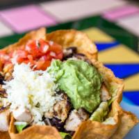 Tostada Salad · Romaine lettuce, black beans, Jack cheese, salsa fresca and guacamole served in a flour tort...