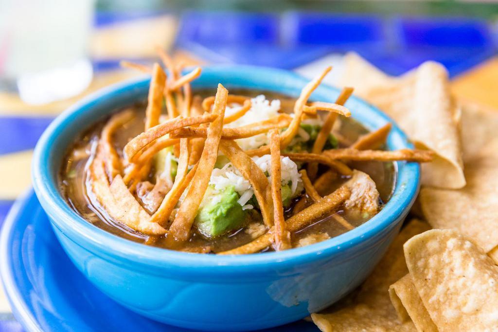 Tortilla Soup · Chicken, avocado chunks, Jack cheese in a spicy tortilla based broth.
