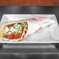 Chicken Gyro · Chicken gyro meat marinated and grilled to perfection served on a fresh pita- topped with le...