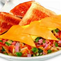 The Skillet Omelet · An omelet stuffed with hashbrowns, ham, green peppers, and onions, then topped with American...