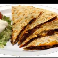 Flat Grilled Chicken Quesadilla · Served with cheese and sour cream, lettuce, and pico de gallo on the side.