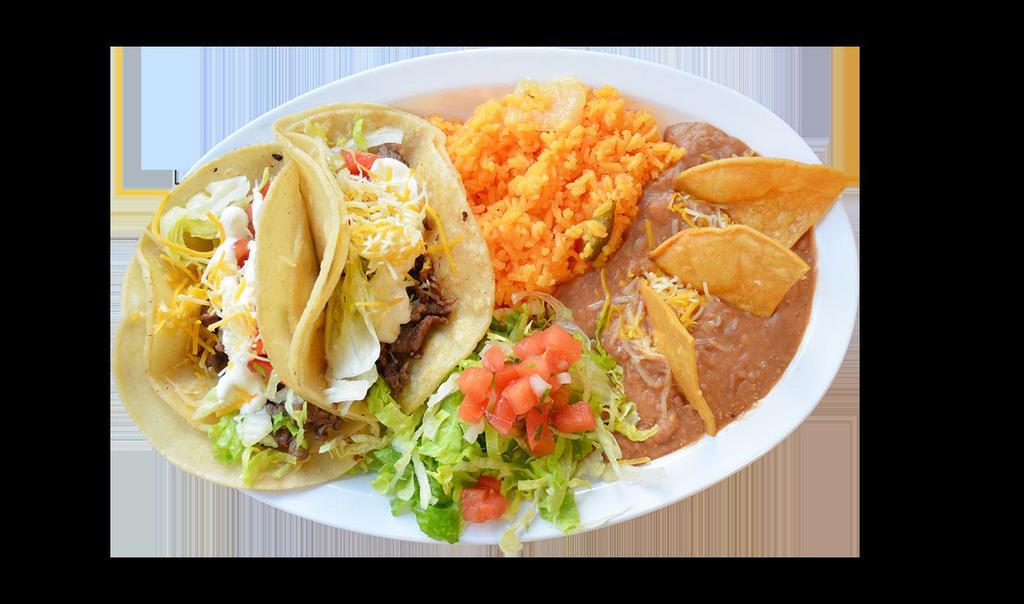 2 Taco Combo · 
Two supreme tacos soft or hard Serve with rice, refried beans garnished with cheese and tortilla chips, lettuce and pico de gallo