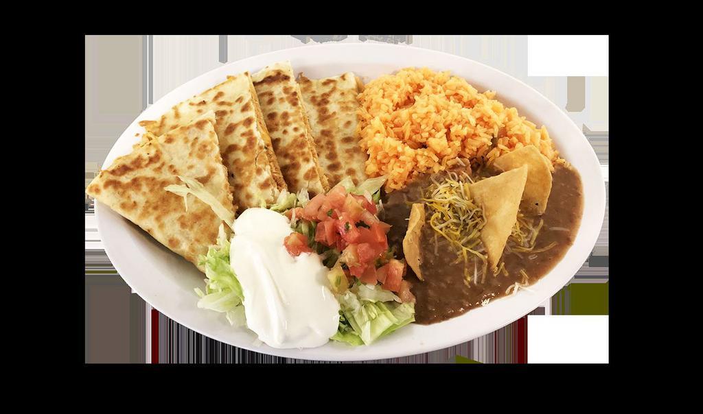 Quesadilla Combo · flour tortilla, cheese, your choice of meat al pastor, steak, homemade chicken, chorizo, carnitas, ground beef, grill chicken or veggie. Serve with rice, refried beans garnished with cheese and tortilla chips, lettuce, sour cream and pico de gallo