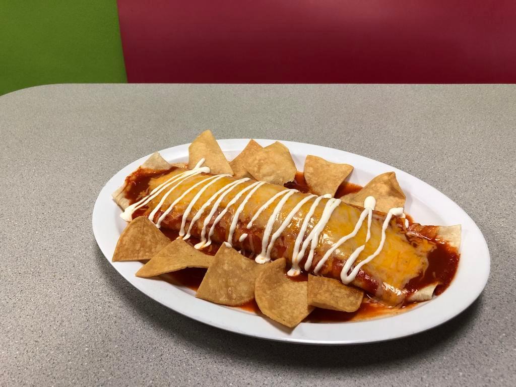 Enchilada Burrito · Choice of meat, rice, beans, cheese, topped with enchilada sauce, sour cream with tortilla chips on the side.