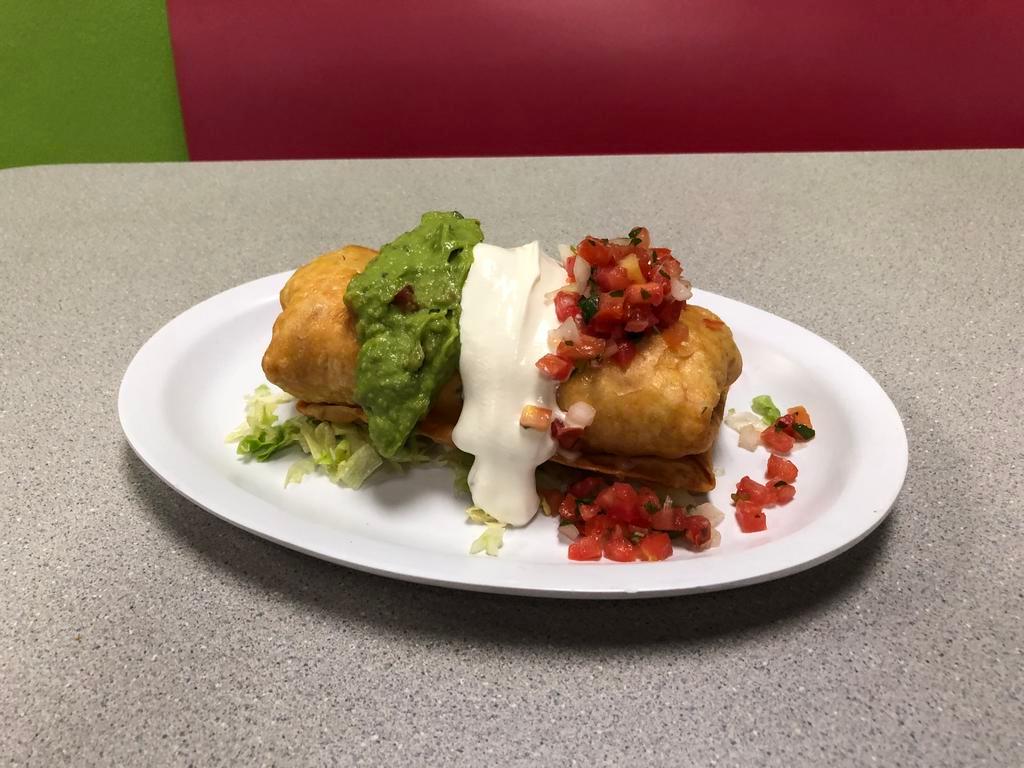 Chimichanga · Deep fry burrito with your choice of meat with rice, beans and cheese inside and topped with pico de gallo, sour cream, guacamole and cheese, serve with rice, refried beans garnished with cheese and tortilla chips