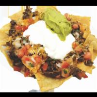 Mix Nachos with 2 Meats · CHOICE OF 2 MEATS, BEANS, CHEESE, PICO DE GALLO, SOUR CREAM AND GUACAMOLE