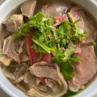 P2. Pho Dac Biet · Sliced eye round beef, meat balls, flank, brisket, tendons and tripe in a rich beef broth wi...