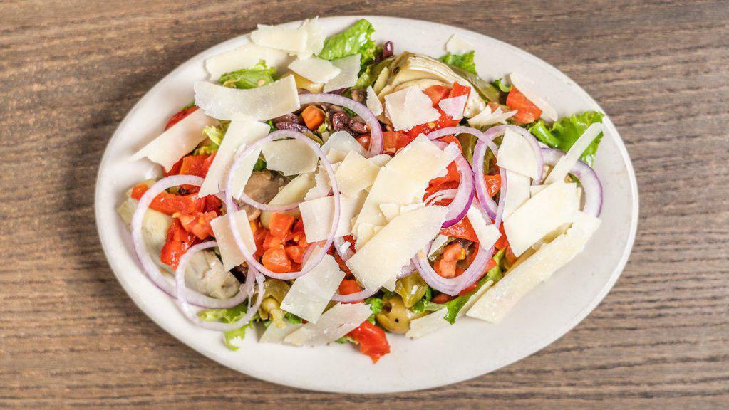 Sicilian Salad · Mixed greens with mushrooms, green peppers, Kalamata olives, Sicilian green olives, artichoke hearts, provolone cheese, salami, roasted red peppers, red onions, diced tomatoes and shaved Parmesan cheese. Tossed in our house dressing.