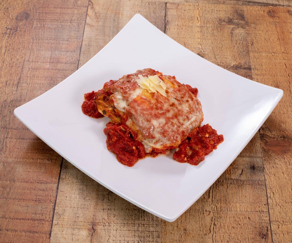 Lasagna · An Italian classic with a traditional meat sauce, baked to perfection. Served with small house salad.