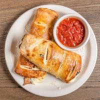 Stromboli · Made to order! Ham, pepperoni, Italian sausage and mozzarella cheese. Served with a side of ...