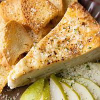 Parmigiano-reggiano Cheesecake · With sliced pears and toasted baguette. Savory not sweet.