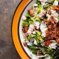 Uncorked Chopped Salad · Crisp romaine, red leaf, smoked turkey, pancetta, crumbled bleu cheese, Roma tomato and toas...