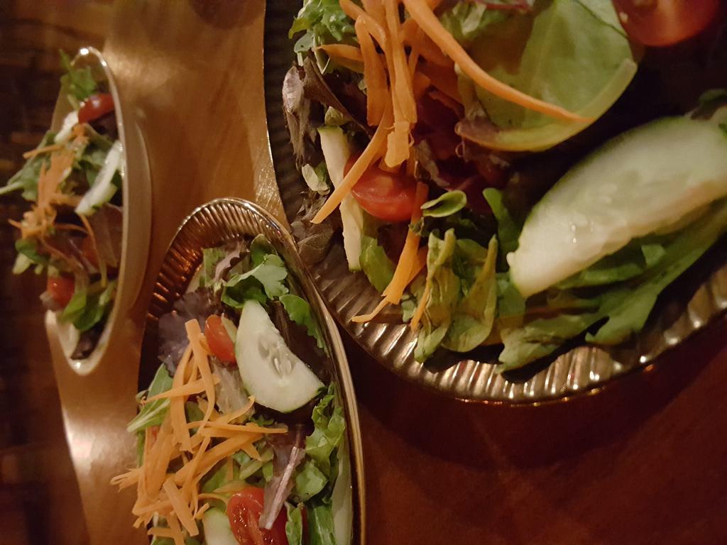 House Salad · Organic mixed greens, Roma tomatoes,  cucumber, carrots and choice of housemade vinaigrette 