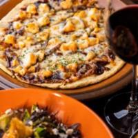 Tangy BBQ Chicken Flatbread · With port caramelized red onions and smoked provolone cheese.