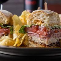 Uncorked Club · Crispy pancetta, smoked turkey and ham butter leaf, vine ripe tomatoes and spicy garlic aioli on a toasted ciabatta roll. Includes choice of side.