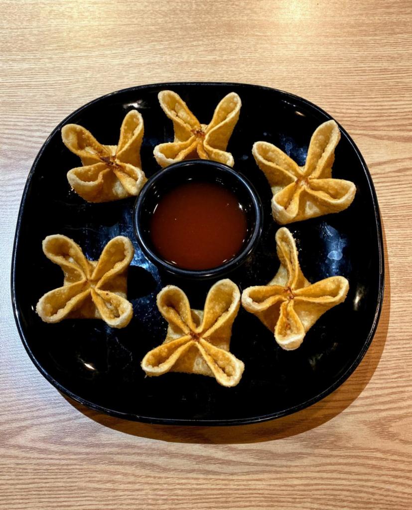 A4. Crab Cheese Wontons · 6 pieces. Cream cheese, imitation crab, chopped green onions. Served with homemade sweet and sour sauce.