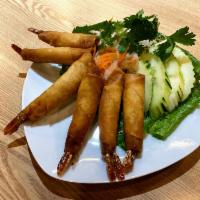 A7. Rocket Shrimp · 6 pieces. Whole marinated shrimp, wrapped in wheat flour paper, served with homemade sweet a...