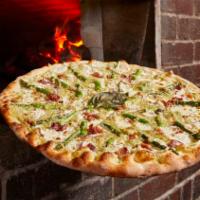 Bacon Asparagus Pizza with Spicy Honey · Artichoke pesto pizza topped with asparagus, bacon and red onion, finished with a drizzle of...