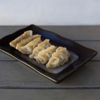 Gyoza · 6 pieces. Pan or deep fried. Traditional pan fried pork dumplings served with our signature ...