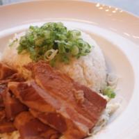 Kakuni Pork Belly Rice · Soy sauce marinated pork belly served atop a bed of rice and mayo-cabbage slaw.