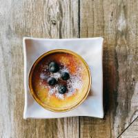 Creme Brulee · Creamy vanilla bean custard with a marbled layer of caramelized sugar.