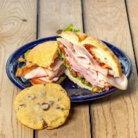 1/2 Paradise Club Sandwich · Oven roasted turkey breast, ham, smoked bacon with creamy Dijon mayo vinaigrette on our butt...