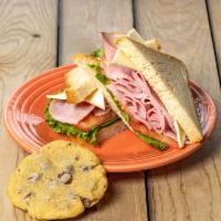 1/2 Ham and Swiss Sandwich · Ham, Swiss cheese and Dijon-mayo vinaigrette on fresh-baked sourdough bread. Served with let...