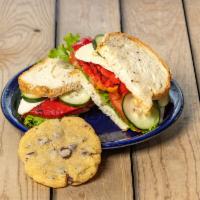 1/2  Paradise Vegetarian Sandwich · Roasted red bell peppers, cucumbers, havarti cheese with homemade pesto-mayo on fresh multig...