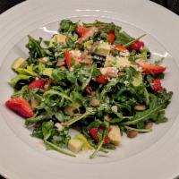Arugula Joven Salad · Baby arugula, avocado, berries, celery leaf, agave vinaigrette, pumpkin seeds, and queso de ...