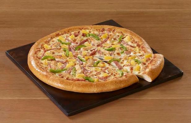 Hawaiian Chicken Pizza · Grilled chicken, ham, pineapple and green bell peppers.