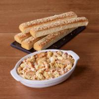 Tuscani Creamy Chicken Alfredo · Grilled chicken and rotini oven-baked in our Alfredo sauce. Served with 5 breadsticks.